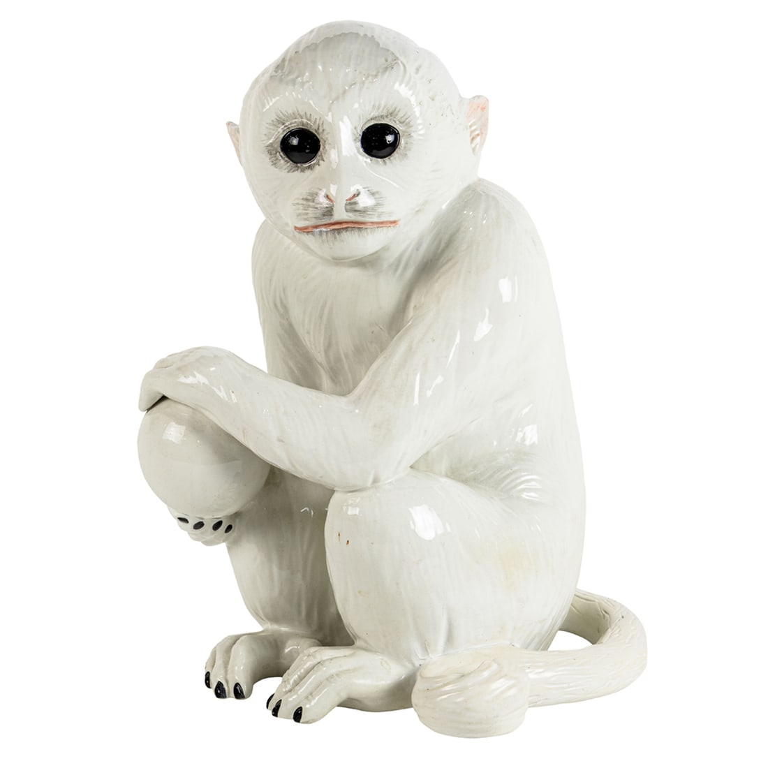 An Italian ceramic figure of a seated monkey: An Italian ceramic figure of a seated monkey, 17.5"h