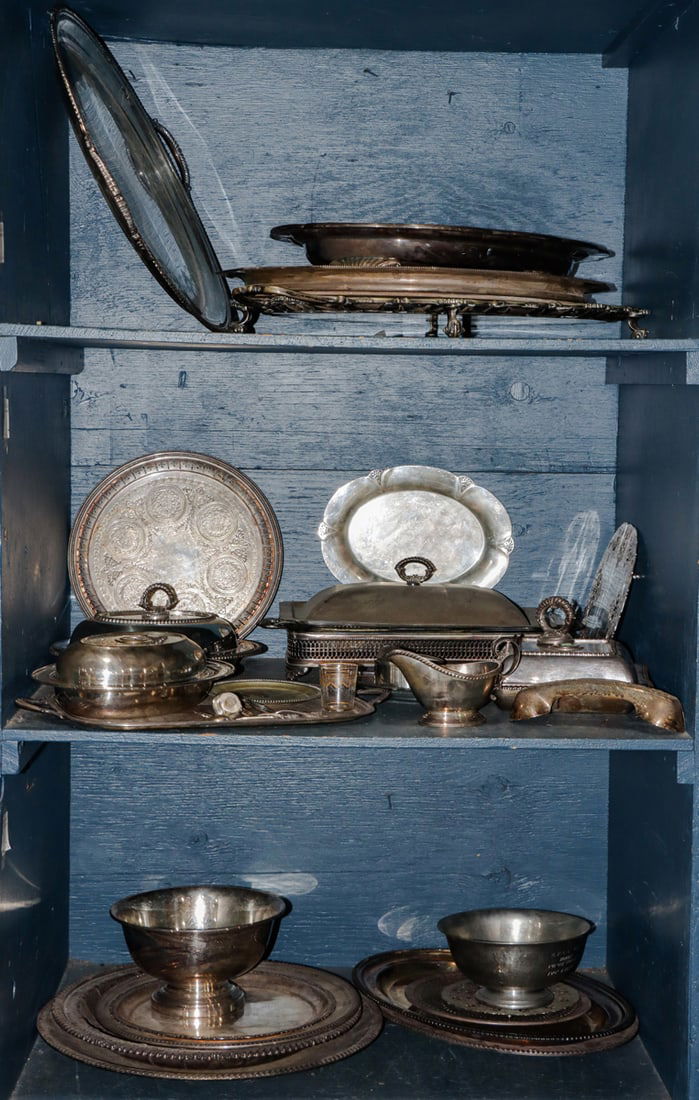 Three shelves of silverplate, some English, comprising trays and others (1 of 1)