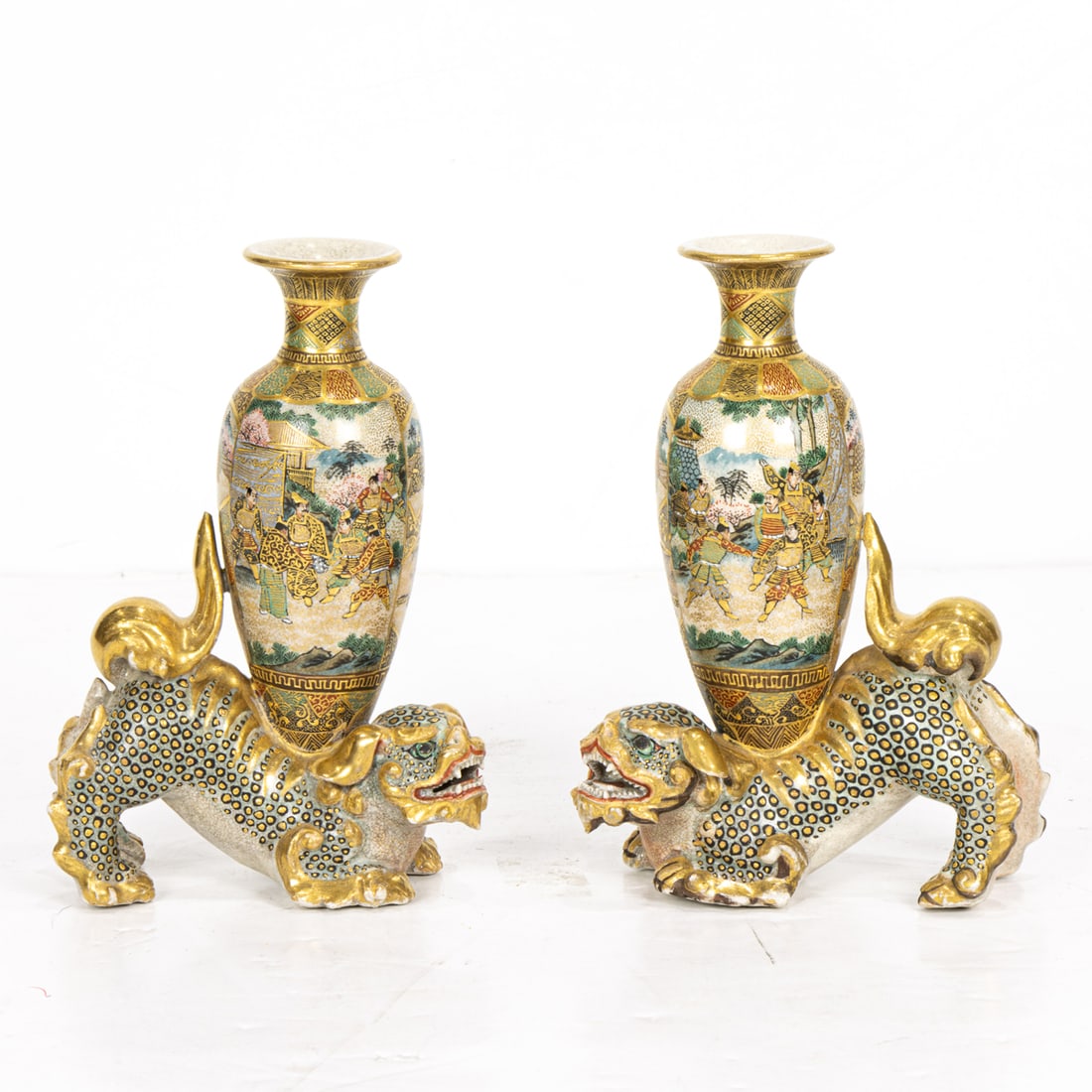 A pair of Satsuma shishi vases: A pair of Satsuma shishi vases. Meiji period, 5.875" high.
