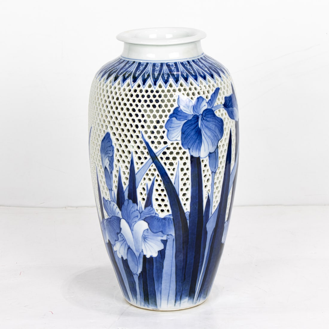 A Hirado blue and white 'iris' vase: A Hirado blue and white 'iris' vase. Meiji period, 11.75" high. Condition: the base base been drilled.