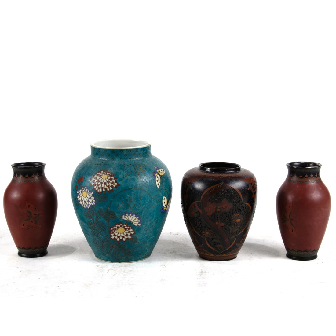 (lot of 4) Japanese cloisonne enamel porcelain vases: (lot of 4) Japanese cloisonne enamel porcelain vases. Depicting butterfly and floral designs, Meiji period, from 4.75" to 6" high.