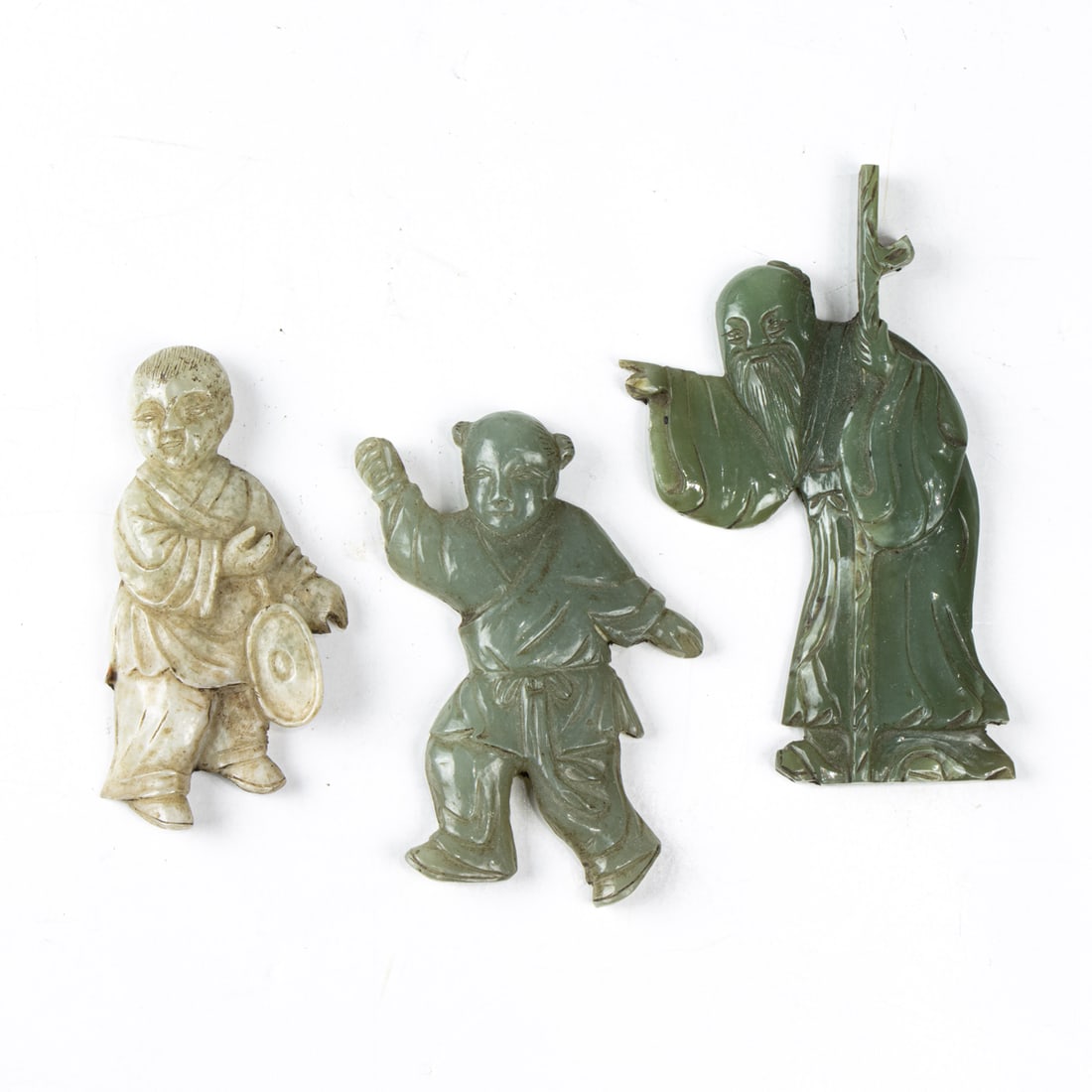 Three Chinese jade figural plaques: Three Chinese jade figural plaques. Qing dynasty, from 3" to 4" high.