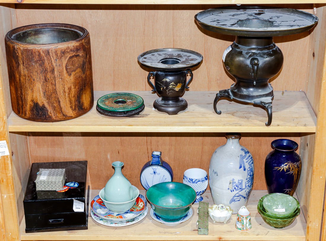 Two shelves of Chinese and Japanese decorative objects: Two shelves of Chinese and Japanese decorative objects. 11.25" tallest.