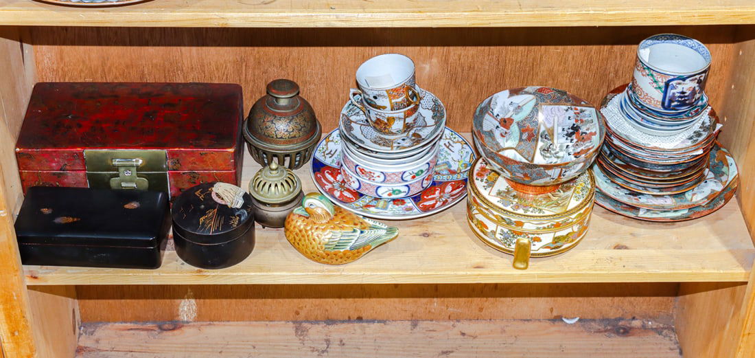 A shelf of Chinese and Japanese decorative objects: A shelf of Chinese and Japanese decorative objects. 20th century, 10" widest.