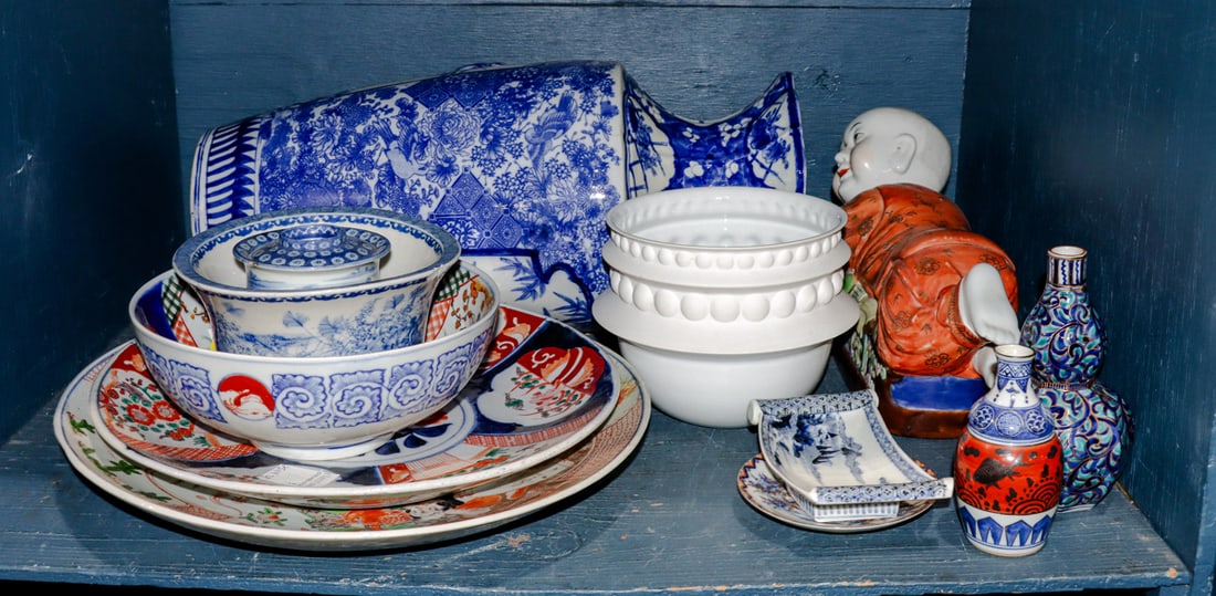 A shelf of Japanese porcelain articles: A shelf of Japanese porcelain articles. 20.75" tallest.