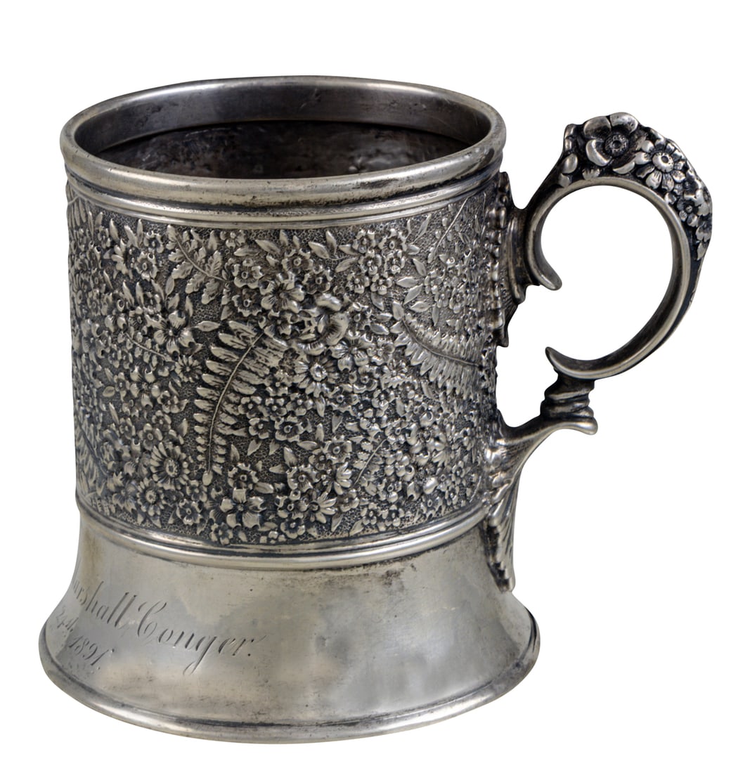 A Tiffany Sterling Childs Cup: A Tiffany Sterling Childs Cup, the body heavily embellished with foliate design. Inscribed 'Frederic Panet Marshall Conger, February 24, 1891', 3.25"h, 6.15 troy oz.
