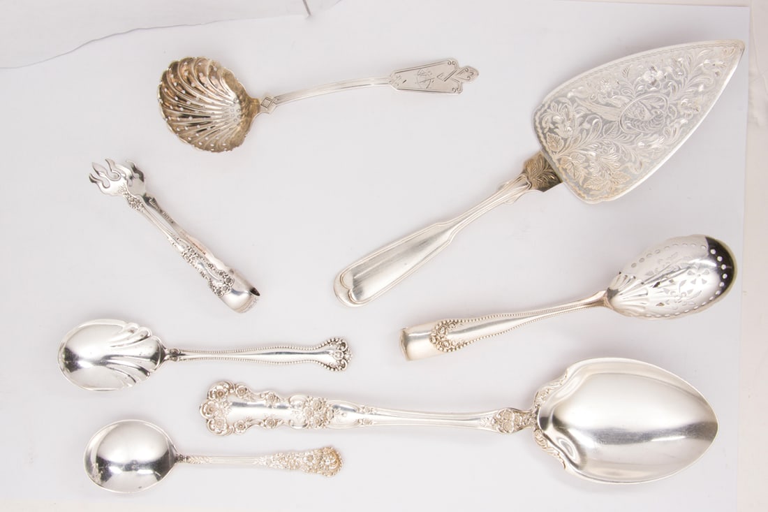 Eight pieces of Sterling Silver Serving Pieces: Eight pieces of Sterling Silver Serving Pieces. Comprising (1) Henry B. Stanwood pastry server, monogrammed 'C.F.B.', 9.5"; (1) Gorham serving spoon, retailed by Greenleaf & Crosby Co., 10.25"; (1) Go
