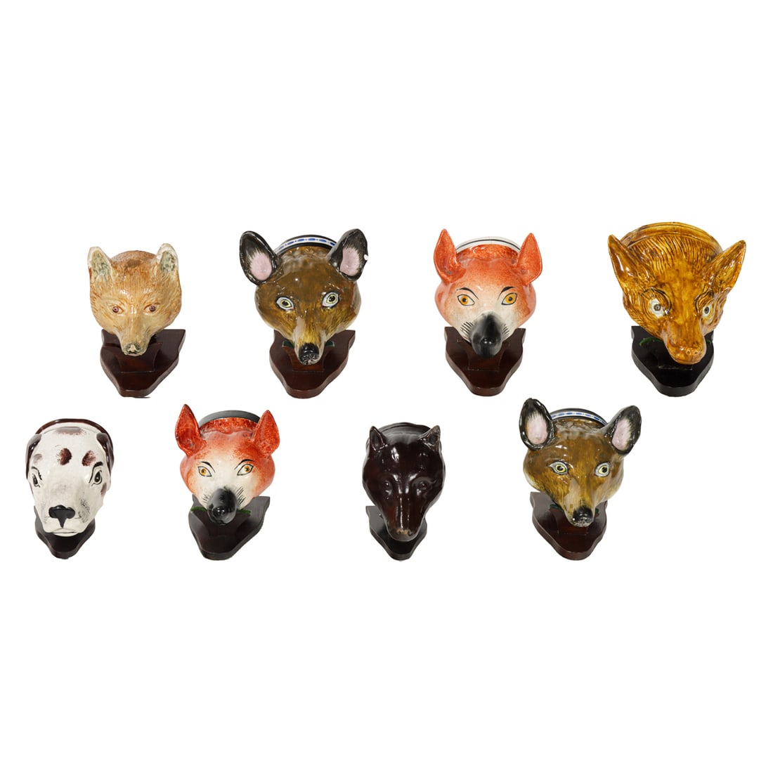 Eight Staffordshire pottery stirrup cups: Eight Staffordshire pottery stirrup cups, second half 18th century, comprising (8) fox heads and (1) hound, between 3.5" and 5"l. Provenance: The Collection of Adolphus Andrews Jr. and Emily Taylor An