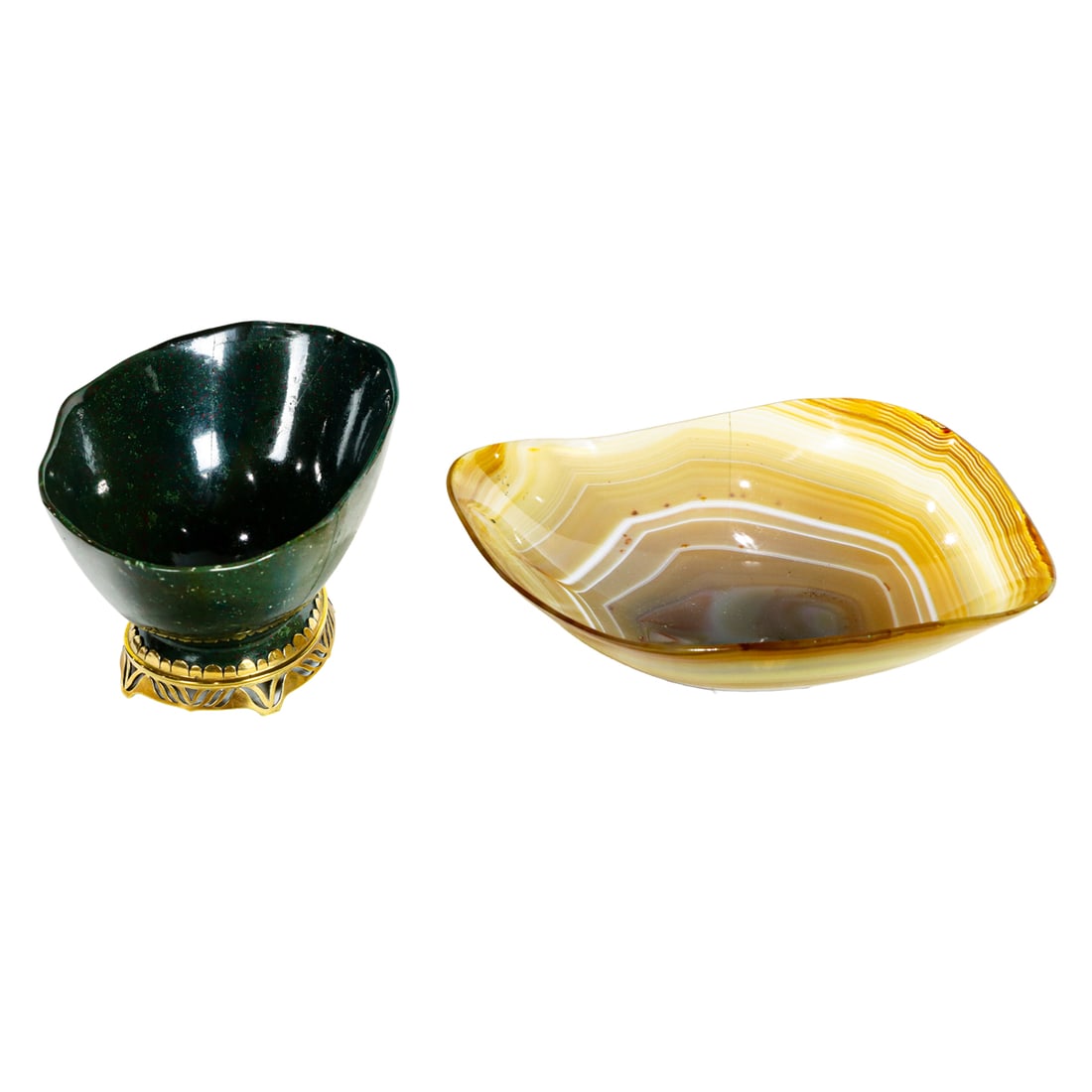An Asprey & Co: An Asprey & Co. 18k gold mounted bloodstone bowl, London, 1968, hallmarked, 2.5"h x 4.75"l, together with a carved banded agate bowl, 1.5"h x 6.5"l [2 total]. Provenance: The Collection of Adolphus An
