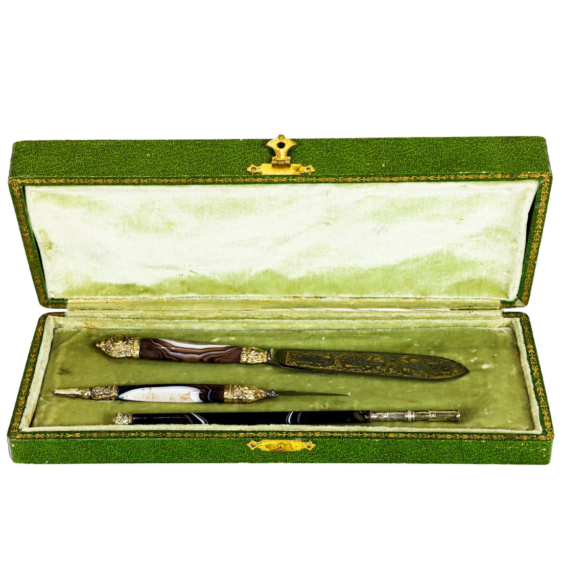 A French vermeil and banded agate handled desk set, 19th century: A French vermeil and banded agate handled desk set, 19th century, including letter opener with damascened blade, knife and dip pen, all within velvet lined tooled gilt leather case, indistinctly marke