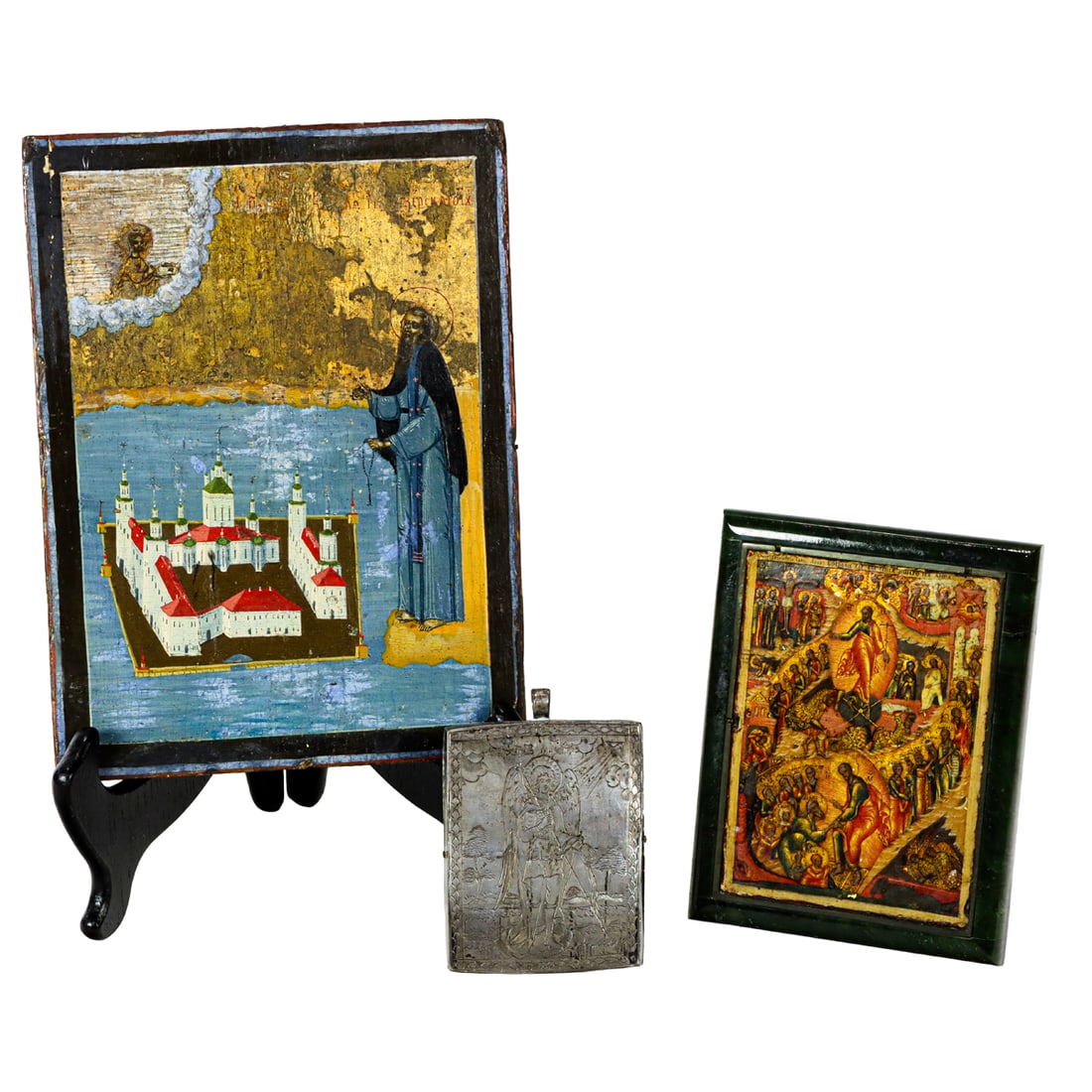 Three icons: Three icons, 18th/19th century, comprising Russian icon of Resurrection of Christ and Descent into Hell, 18th century, tempura on panel within green hardstone frame, 5"h x 4"w; icon of St. Cyril of No