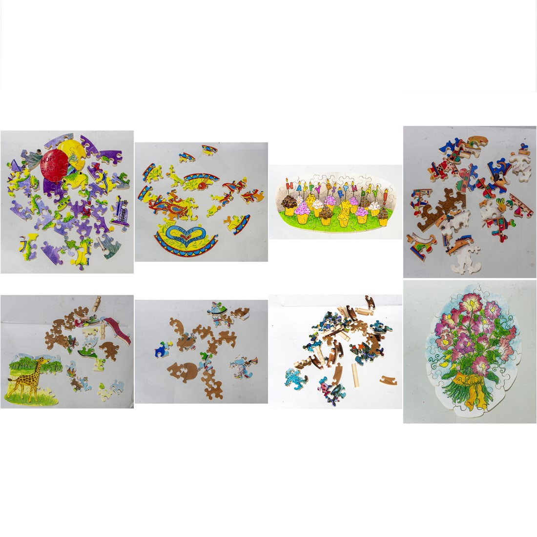 A group of eight small Stave Puzzle painted wood jigsaw puzzles: A group of eight small Stave Puzzle painted wood jigsaw puzzles, seven boxes with gold foil label with jester, box 3" x 3" x 2." Provenance: The Collection of Adolphus Andrews Jr. and Emily Taylor