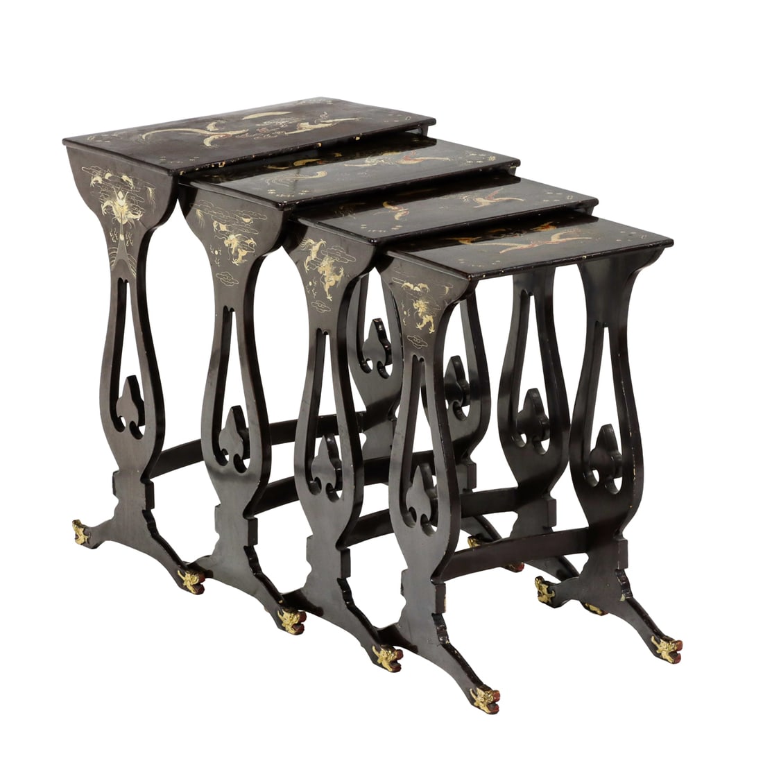 A set of four Regency style lacquer nesting tables in the Asian taste: A set of four Regency style lacquer nesting tables in the Asian taste, each top depicting dragons and mystical scenes, the sides further decorated with gilt dragon reserves, and resting on beast form