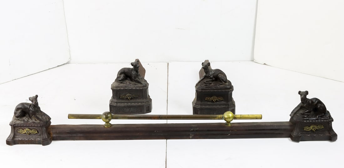A pair of European cast iron andirons and matching firefront cast with dogs: A pair of European cast iron andirons and matching firefront cast with dogs, each with recumbent hound, andirons: 6.5"h x 5.5"w x 14"d; firefront: 36.5"l