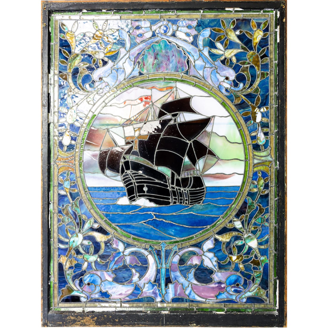 A large American leaded slag and colored glass window glass of ship in the Tiffany style (1 of 5)