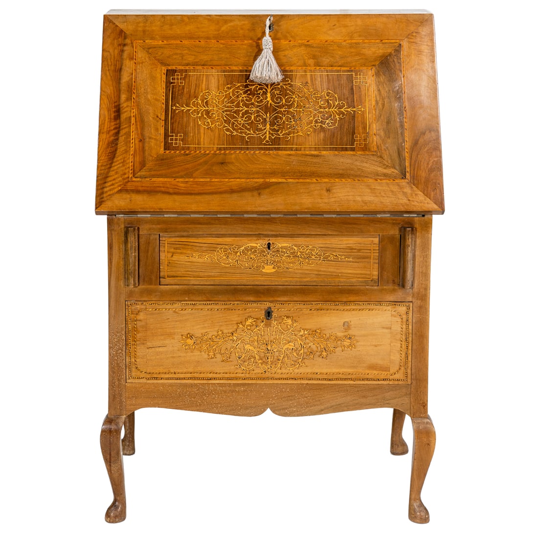 A Continental secretary circa 1870: A Continental secretary circa 1870, the inlaid case with a fall front over the two drawers, each with marquetry decorated fronts, and resting on cabriole legs, 46"h x 31"w x 19"d