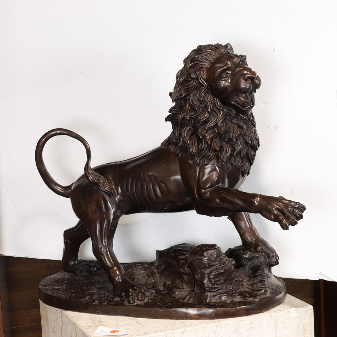 A large Erik Kramer patinated bronze model of a lion: A large Erik Kramer patinated bronze model of a lion, signed, approximately 21"h x 25"l