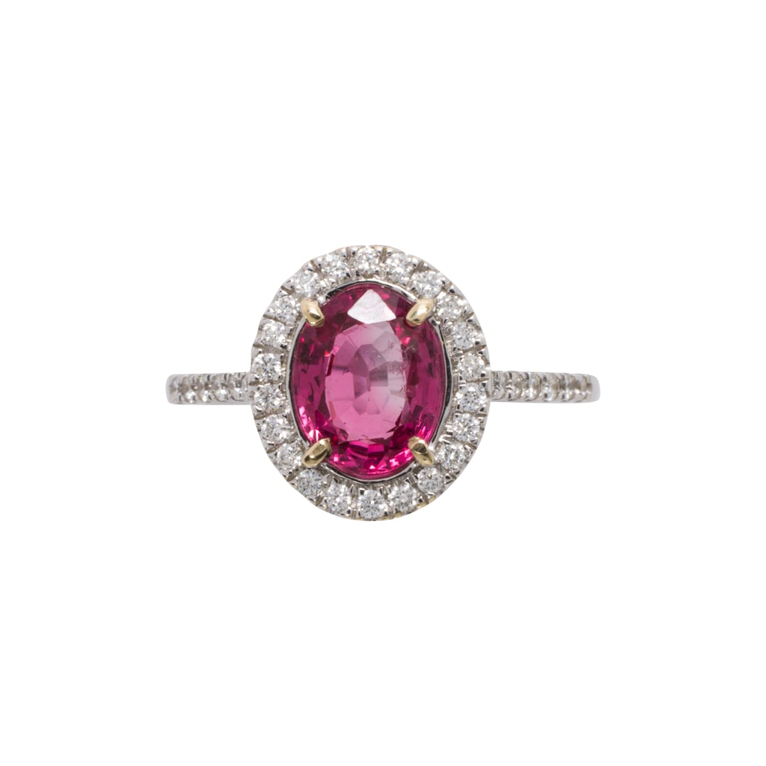 A spinel, diamond, and 18k white gold ring: A spinel, diamond, and 18k white gold ringDesigned with an oval-cut spinel weighing 1.50 carats, framed by a halo of round brilliant-cut diamonds and round brilliant-cut shoulders; size 7; 2.45 grams