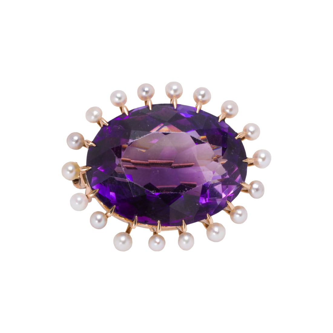 An amethyst, seed pearl, and 14k gold brooch: An amethyst, seed pearl, and 14k gold broochSet with an oval-cut amethyst measuring approximately 18.40 x 13.95 x 9.83 mm, framed by a halo of 18 seed pearls; length: 7/8 in; 6.10 grams
