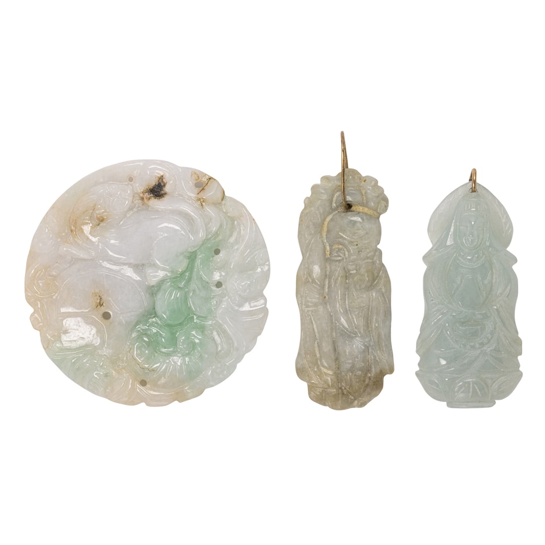A carved jade pendant: A carved jade pendantDepicting animals and vegetation; width: 2 1/8 in; 34.85 grams