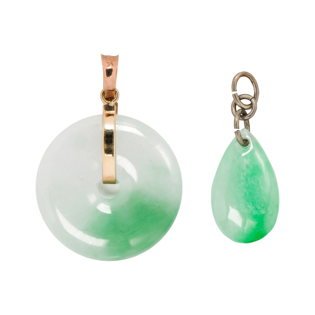 Two jade, 18k gold, and metal pendants: Two jade, 18k gold, and metal pendantsComprising one bi disc set within 18k gold mounting, one droplet set with metal bail; lengths: 1 1/2 and 1 1/4 in, respectively; gross weight: 11.20 grams
