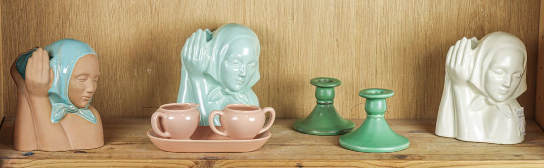 A group of eight Catalina Pottery articles including vases: A group of eight Catalina Pottery articles including vases. Comprising (3) female bust vases; (1) pair of sugar and creamer with undertray; (1) pair of candlesticks. Greatest 6.75"h. [Total 8]