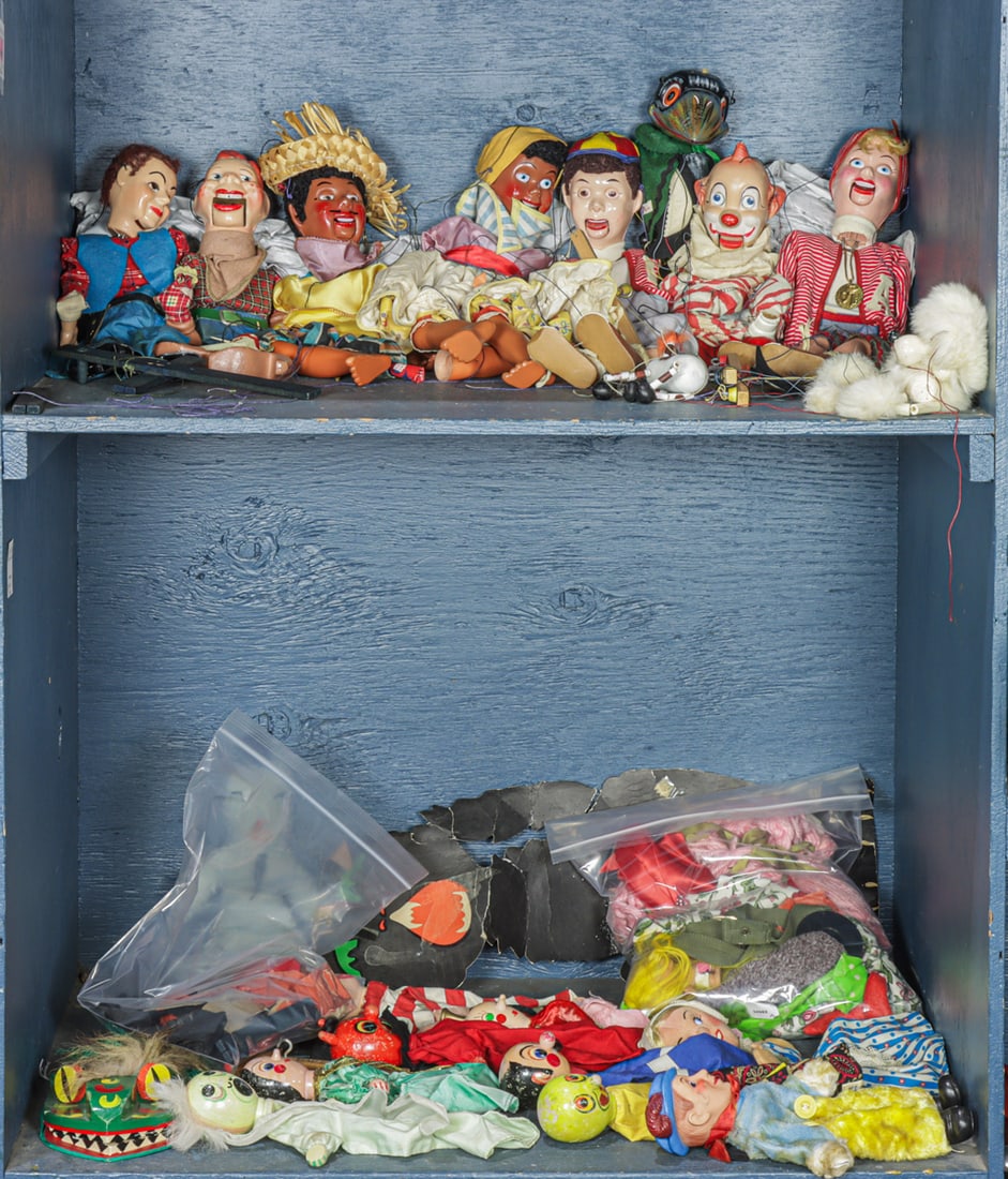 A large group of vintage puppets and marionettes: A large group of vintage puppets and marionettes, including Howdy Doody Jerry Mahoney; Clarabell; poodle; Pelham crow; Walt Disney Prince Charming handpuppet; various painted wood and fabric