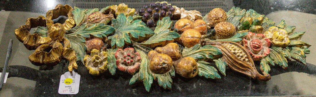 A Continental carved wood applique of a ribbon tied garland of fruit: A Continental carved wood applique of a ribbon tied garland of fruit. 30"l