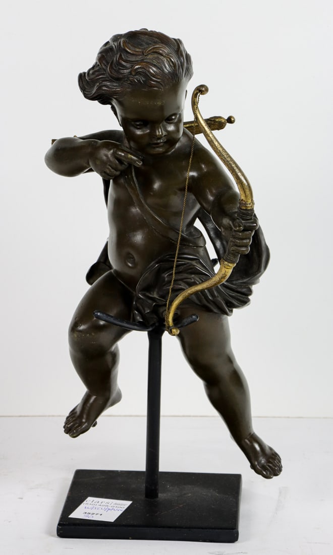 A Rococo style patinated bronze figure of a putto (1 of 1)