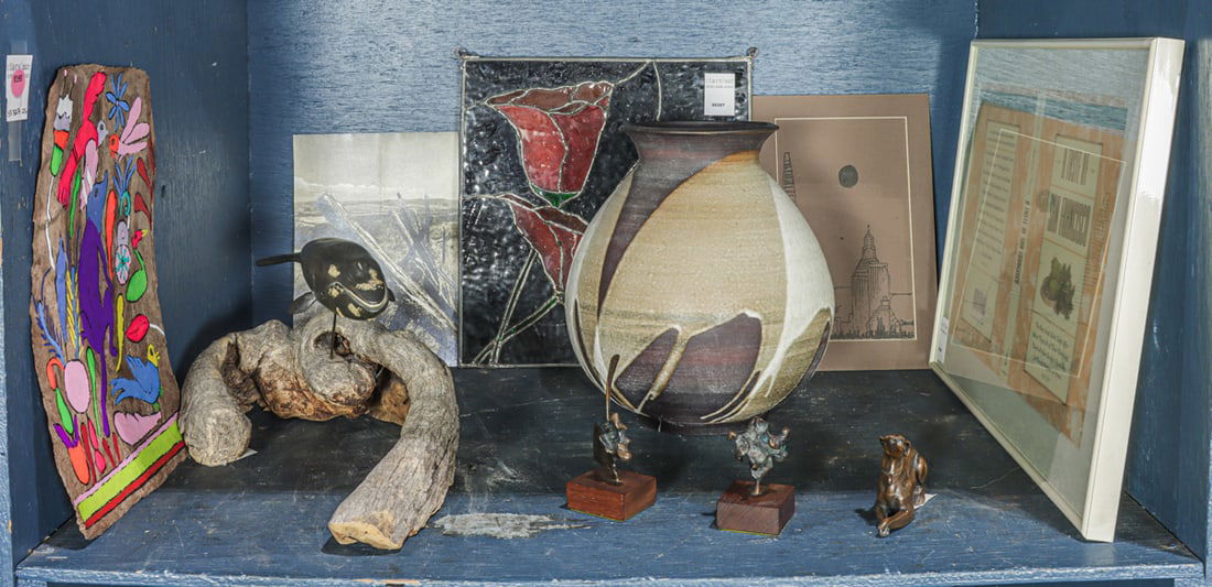 An assembled group: An assembled group, including leaded glass panel of poppy; pair of bronze organic form sculptures, stoneware vase; whale on driftwood plinth, 17"l, etc.