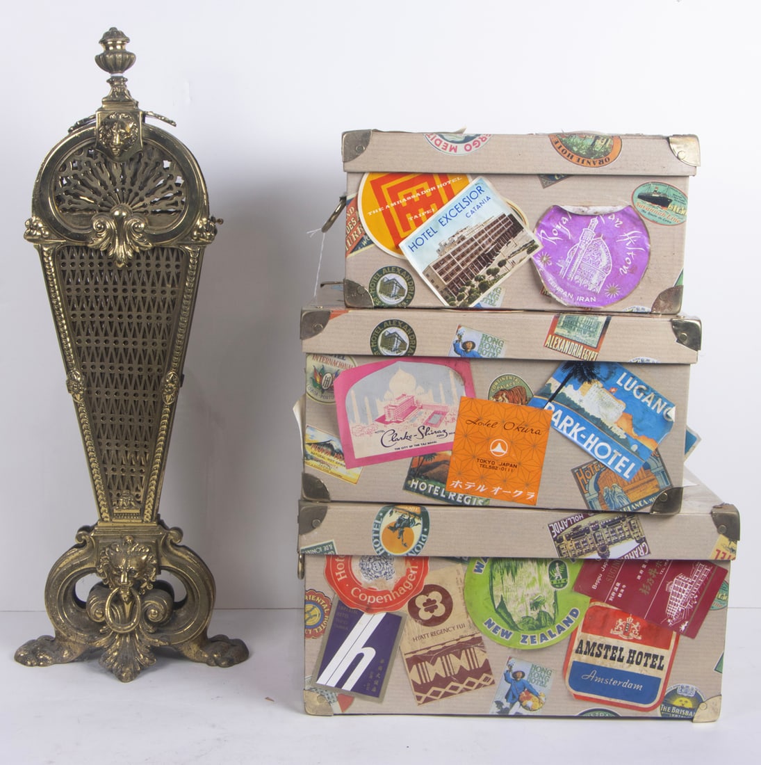 A brass folding fan shaped firescreen and a set of decoupage boxes: A brass folding fan shaped firescreen, 24.5"h and set of three decoupage decorated boxes, [4 total]