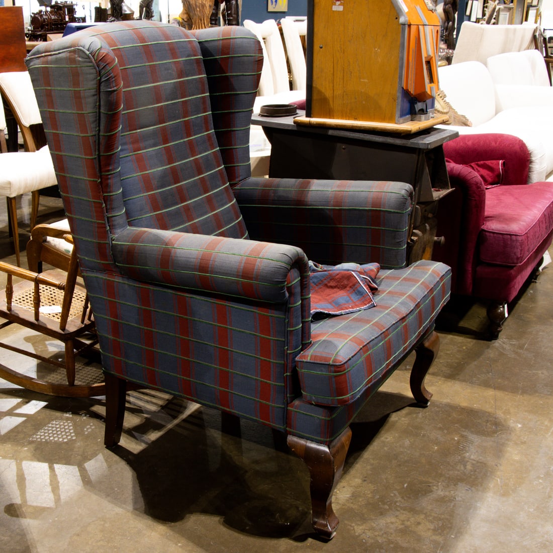 A group of lounge chairs: A group of lounge chairs, one a wingback chair, 42"h x 29"w x 24"d