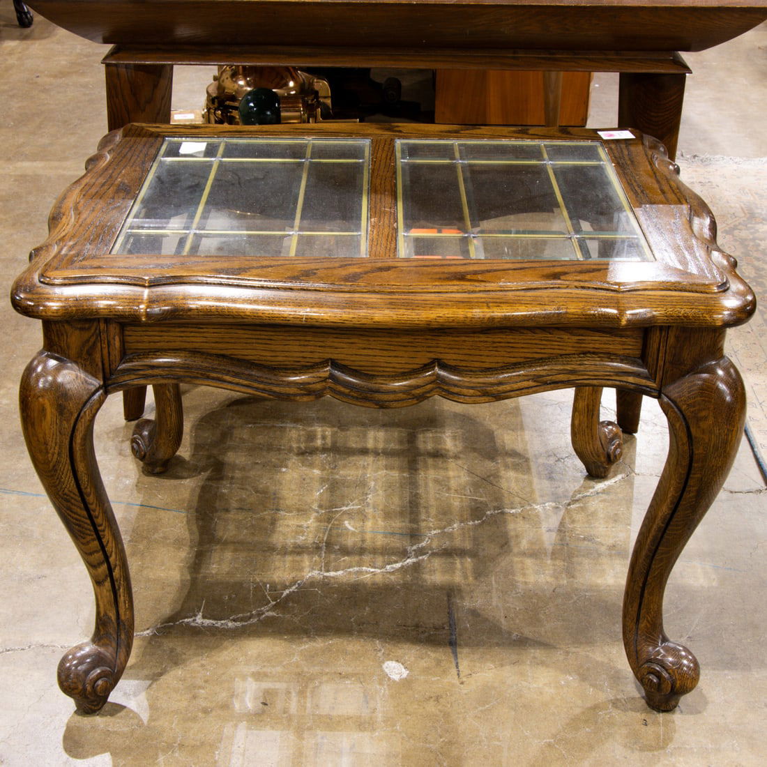 A furniture group: A furniture group, including an oak and glass side table 22"h x 25"w x 32" and square cocktail table 16"h x 60"w x 32"d,