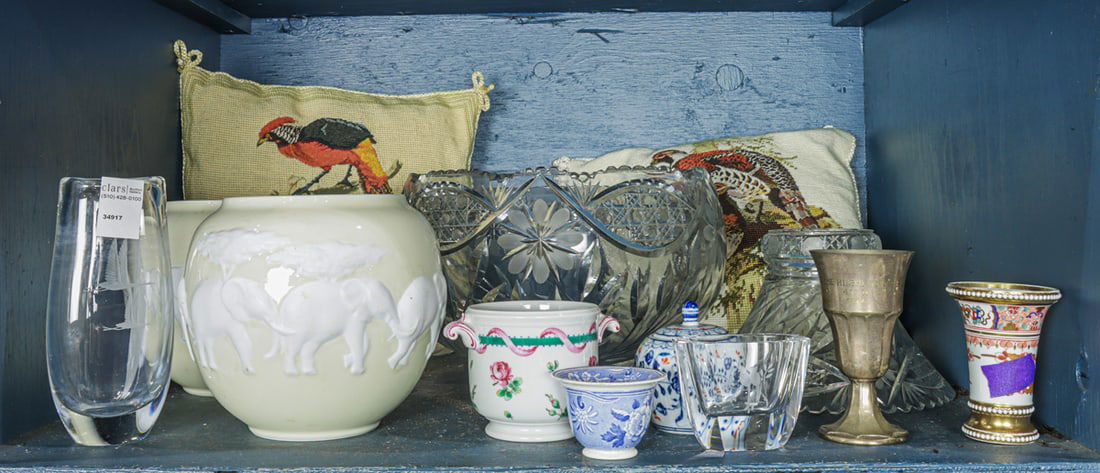 An assembled group: An assembled group, including cut glass punch bowl on stand; pair of Raynaud & Co. Limoges partial bisque porcelain 'Kenya' globular vases, 7.75"h; pair of needlepoint cushions; Orrefors glass vase; G