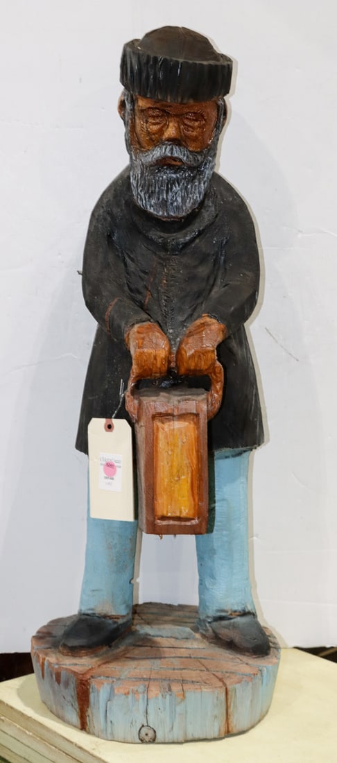 A Folk Art carved and painted figure of a fisherman: A Folk Art carved and painted figure of a fisherman, depicted holding a lantern, 33"h