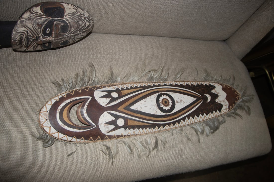 An Oceanic carved and painted mask: An Oceanic carved and painted mask, likely Papua New Guinea, 28"l