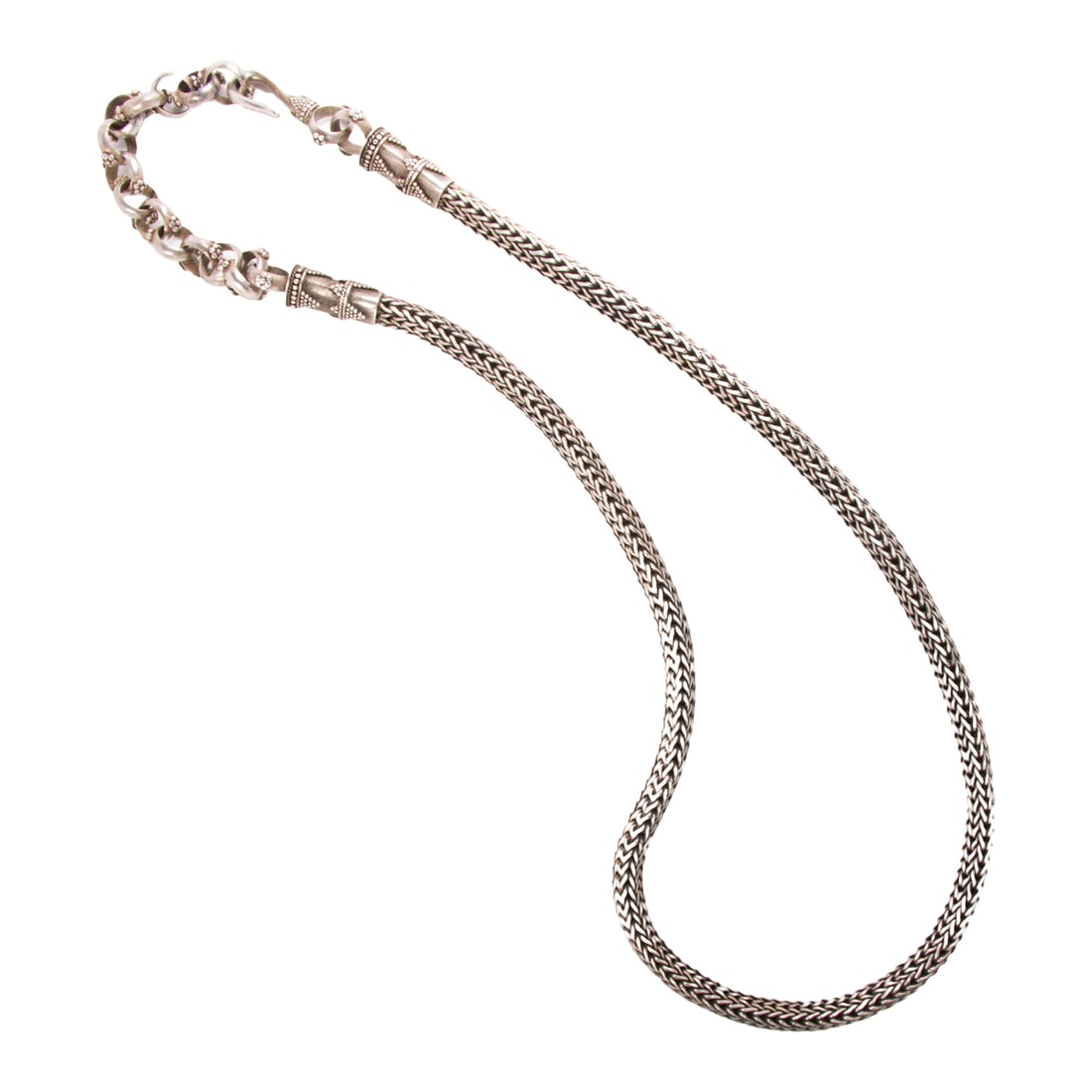 A woven silver belt: A woven silver beltOf South Asian design; length: 34 in; 262.70 grams