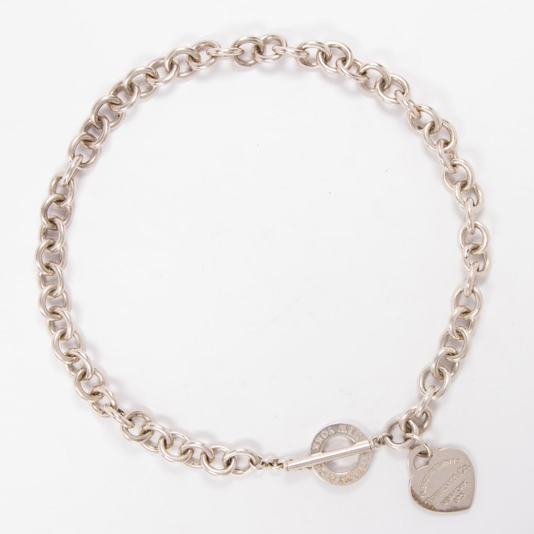 A 'Return to Tiffany' Tiffany & Co. sterling silver necklace: A 'Return to Tiffany' Tiffany & Co. sterling silver necklaceDesigned with a heart toggle on cable-link chain; length: 15 1/2 in; 67.40 grams