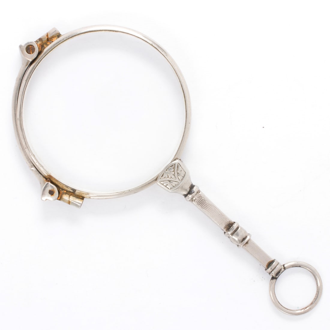 An antique silver lorgnette: An antique silver lorgnetteSpring-set, featuring etched accents; length (folded): 3 3/4 in; 24.85 grams