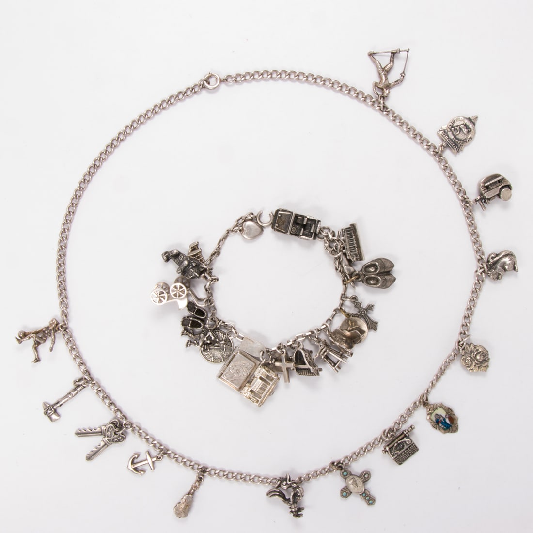 A silver charm necklace and bracelet (1 of 1)