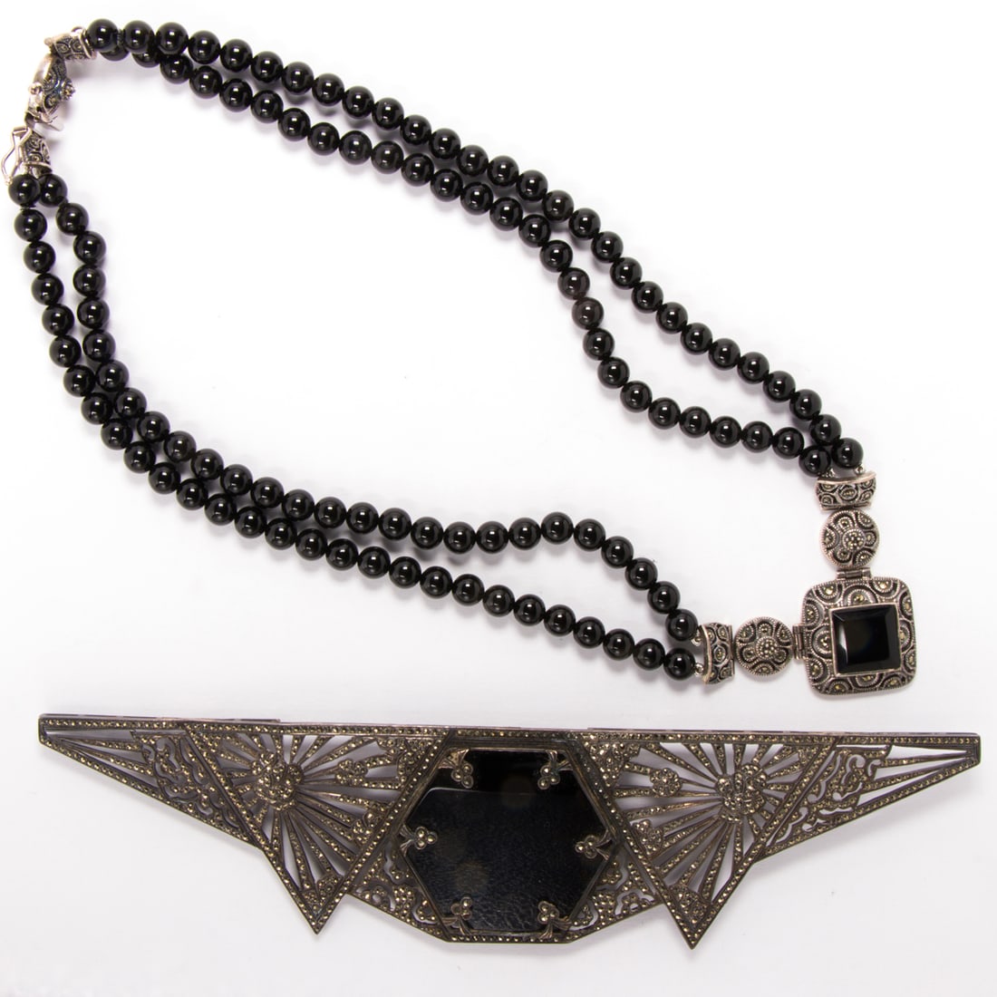 A brooch and beaded necklace (1 of 1)