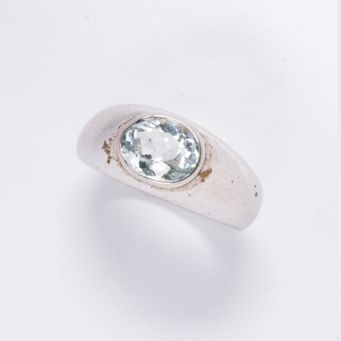 An aquamarine and sterling silver ring: An aquamarine and sterling silver ringSet with an oval-cut aquamarine weighing 1.40 carats; size 6; 3.35 grams