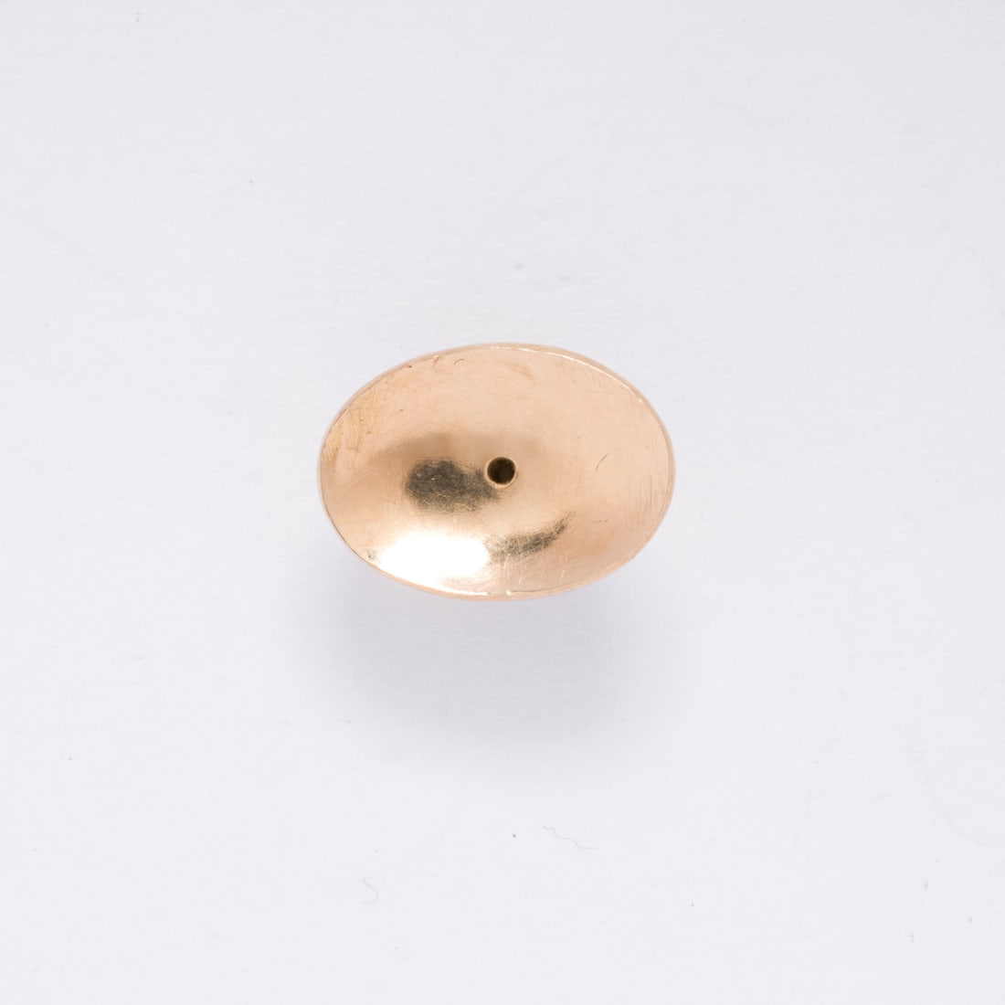 A 14k gold earring back: A 14k gold earring backOf polished finish; 1.40 grams