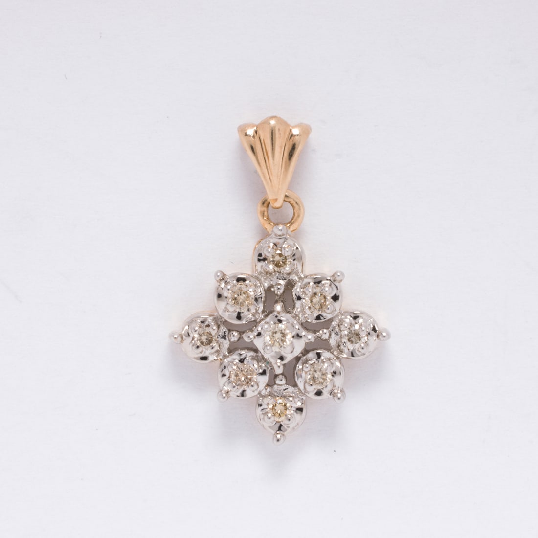 A diamond and 10k bi-color gold pendant (1 of 1)