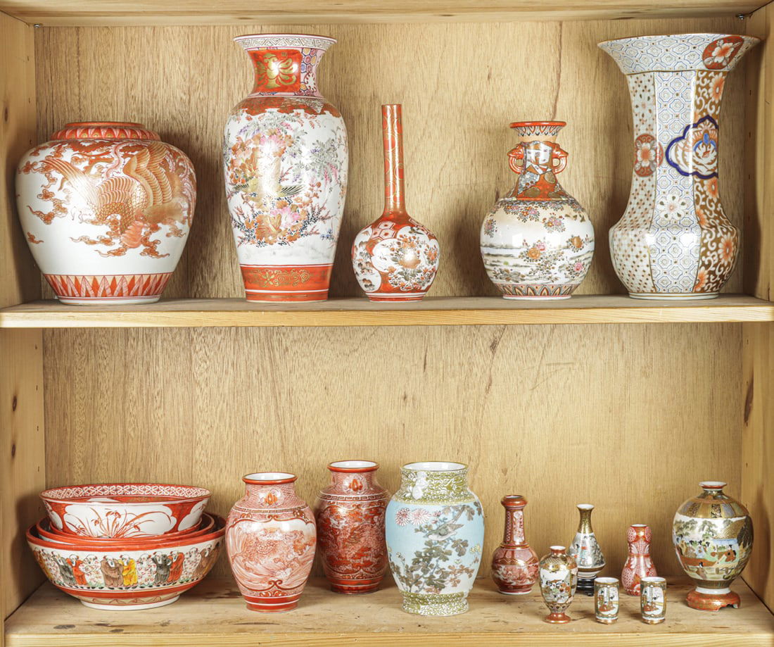 Two shelves of Kutani vases and bowls: Two shelves of Kutani vases and bowls. Meiji period, 12.25" tallest.