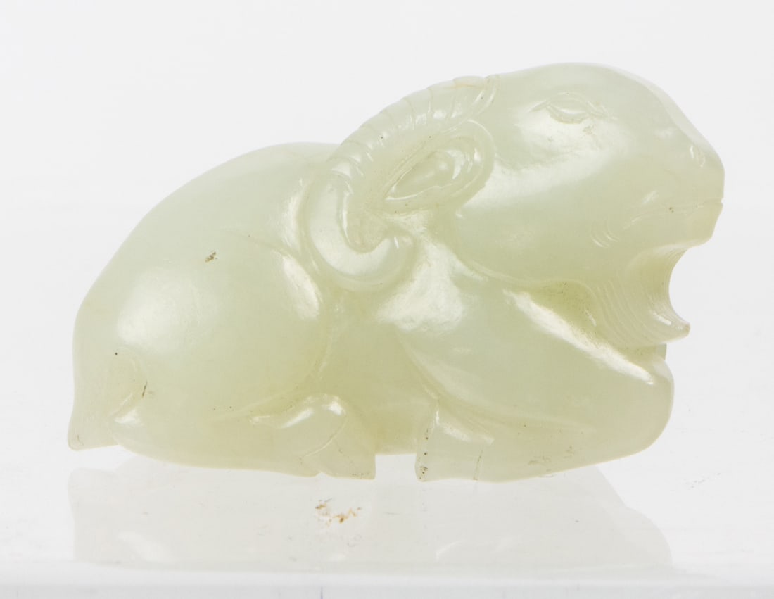 A Chinese white jade 'ram' pendant: A Chinese white jade 'ram' pendant. 1.75" across.