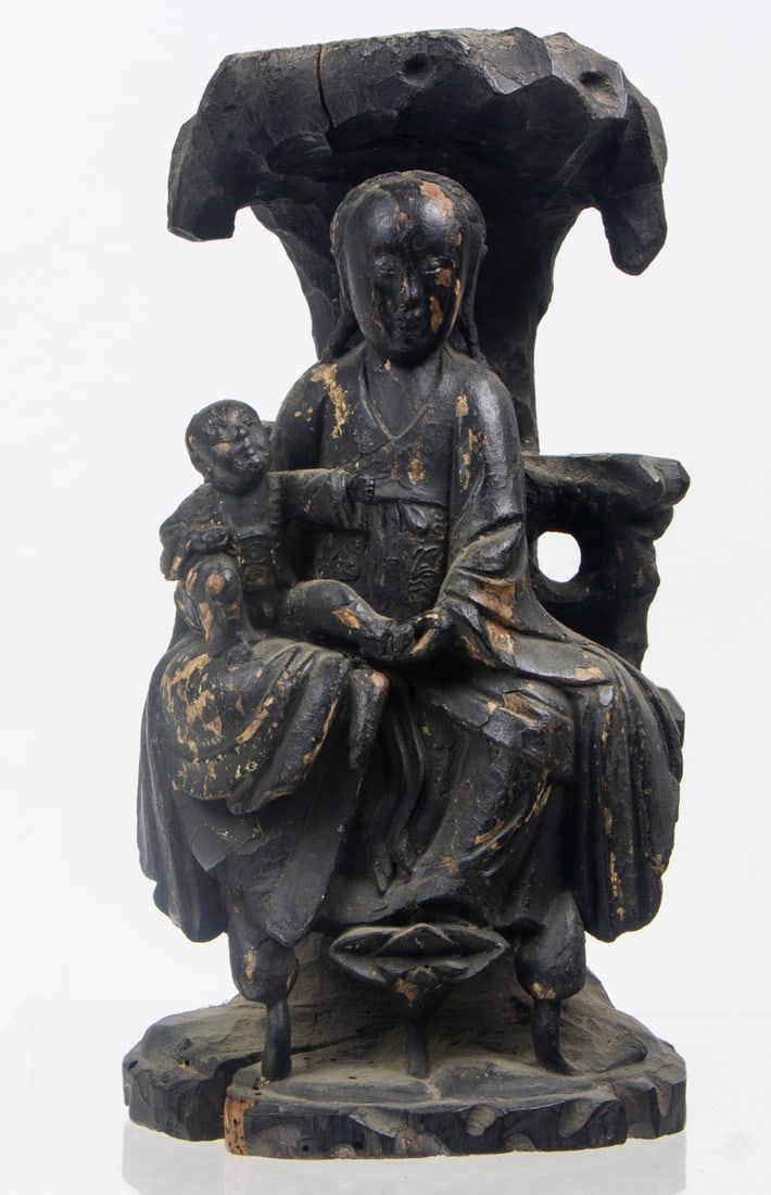 A Chinese black lacquered figure of Guanyin and Child group: A Chinese black lacquered figure of Guanyin and Child group. Qing dynasty, 12" high.