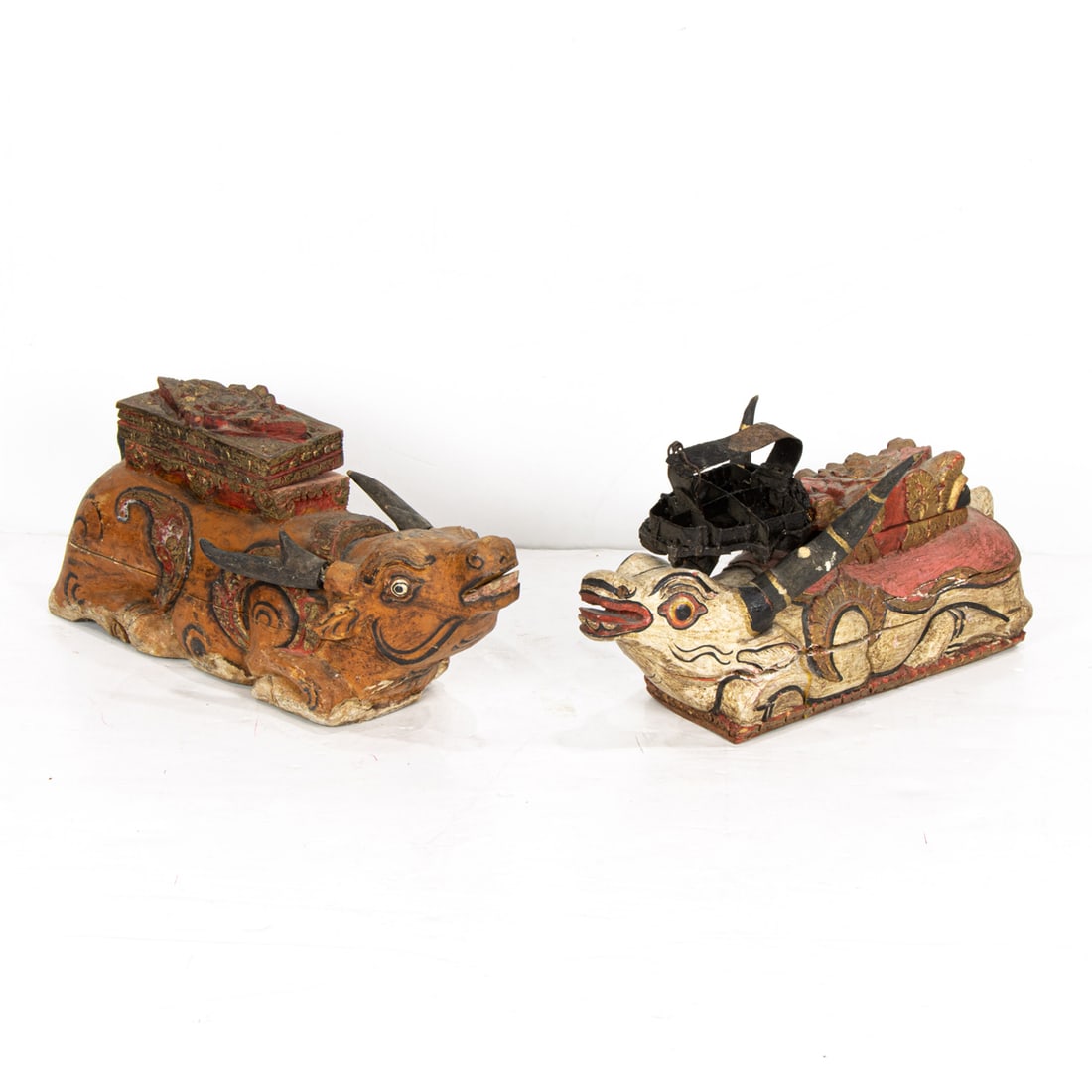 A group of Southeast Asian decorative objects: A group of Southeast Asian decorative objects. Including a pair of carved figural boxes, and an Indonesian batik brass printing block, 14.5" longest.