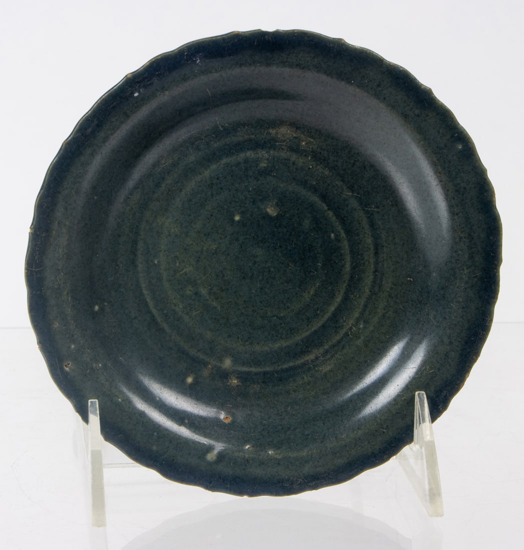 A Chinese blue glazed foliate dish: A Chinese blue glazed foliate dish. Kangxi period, 2.25" wide.