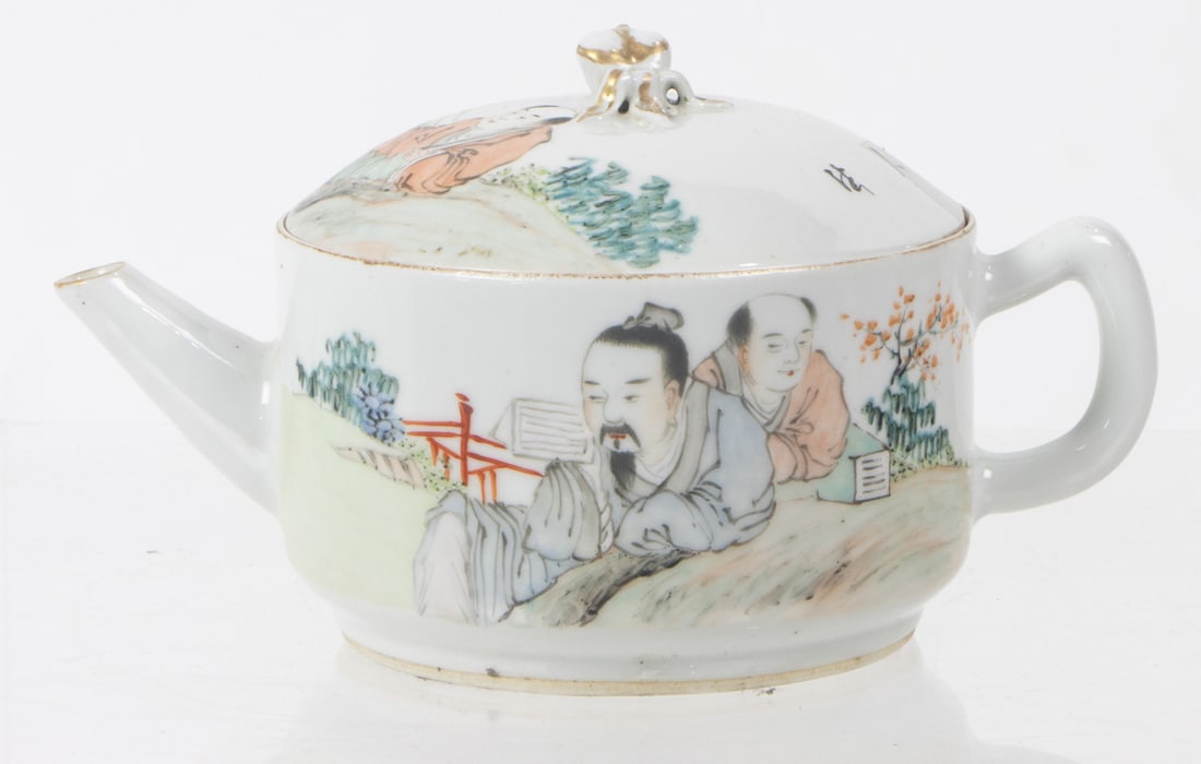A Chinese Qianjiangcai teapot: A Chinese Qianjiangcai teapot. Featuring figures in the garden setting, 3.875" high.